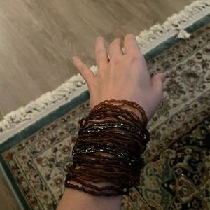 Beaded bracelet , copper color with sparkly beads .